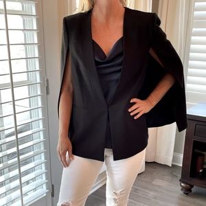 Black cape style jacket.